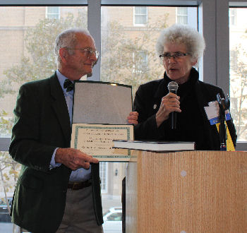 Dr. Meyer receiving the Volunteerism and Community Service Award