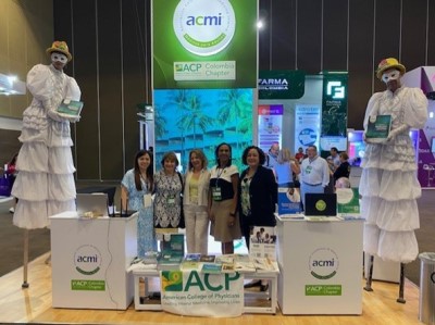 Dr. Allende Vigo with ACP and chapter staff at the ACP/ACMI exhibit booth.